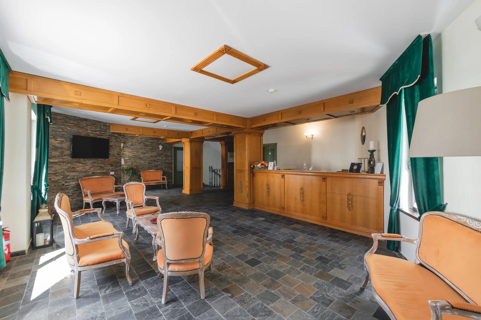 The lobby of Vila Seva, with velvet sofas